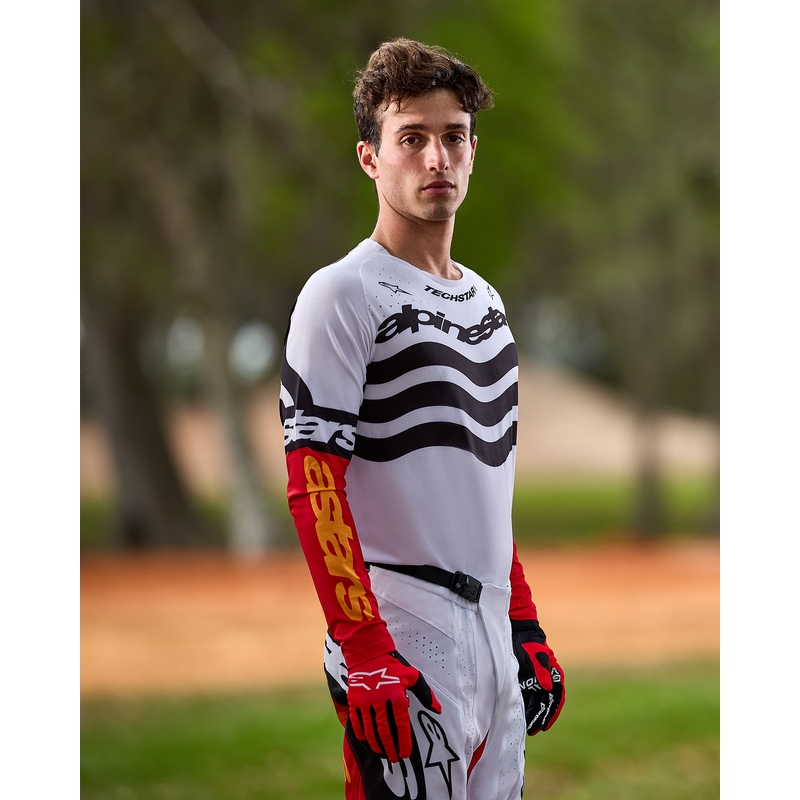 Motokros hlače Alpinestars Techstar omejena izdaja temno črno-belo-fluo rdeče-oranžne