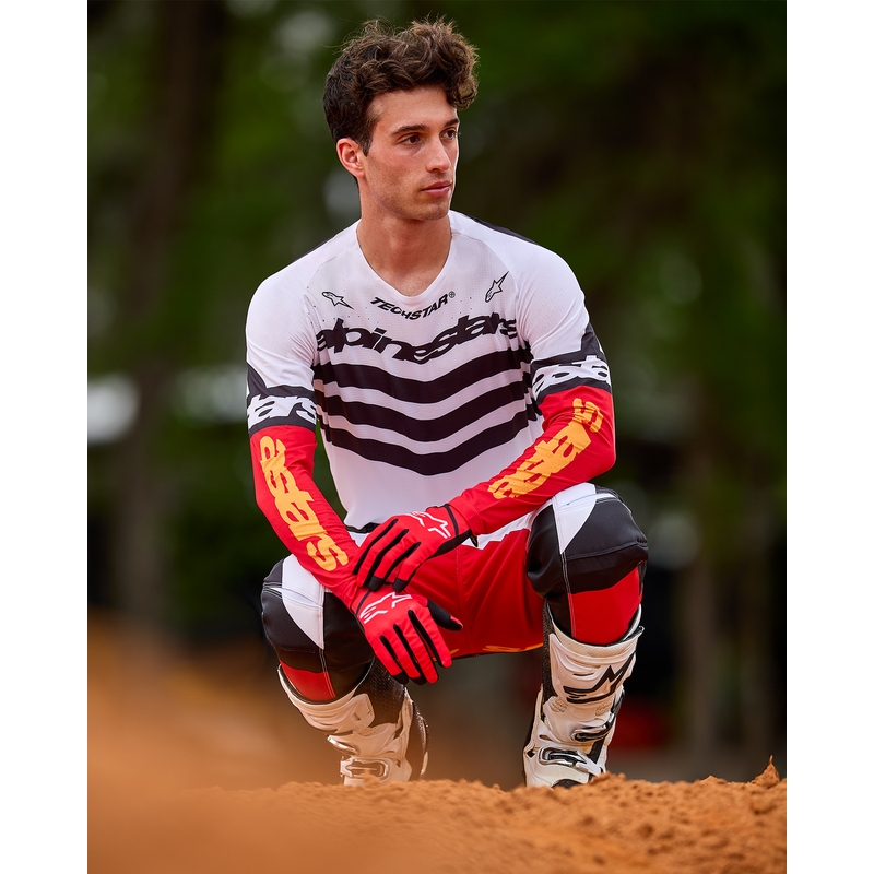 Motokros hlače Alpinestars Techstar omejena izdaja temno črno-belo-fluo rdeče-oranžne